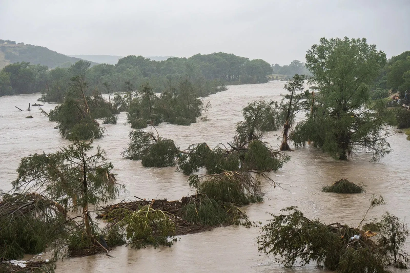 Trees emerge from flood waters along the Guadalupe River on July 4, 2025, in Kerrville, Texas. Source: abc6onyourside.com